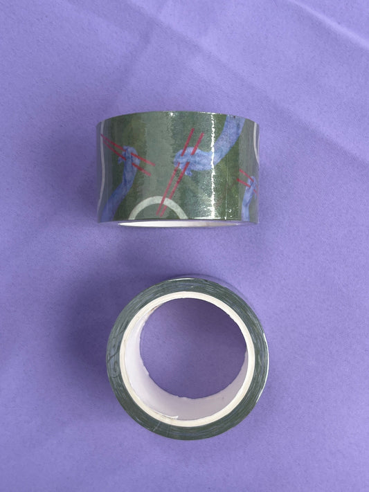 Two rolls of green washi tape with a pattern of blue hands holding chopsticks on a purple surface